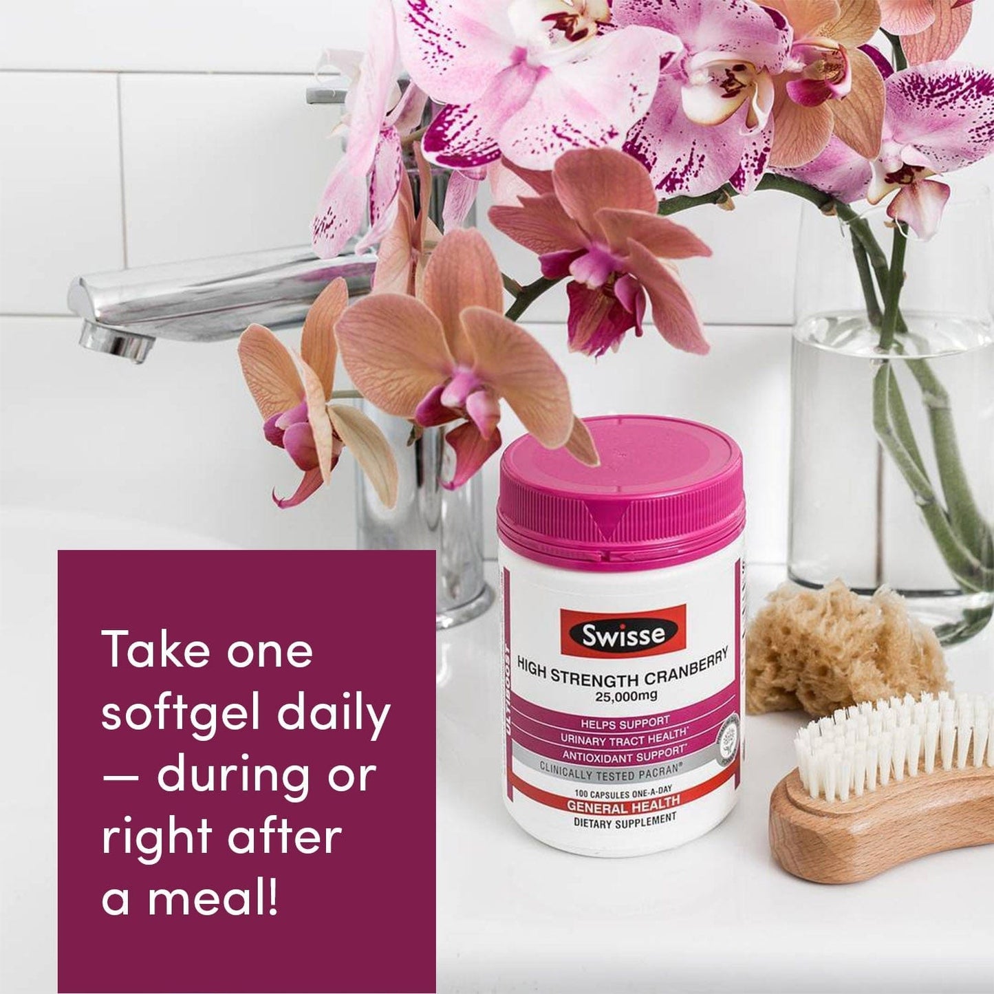 Swisse Cranberry bottle on a counter next to flowers, body brush, and soap.