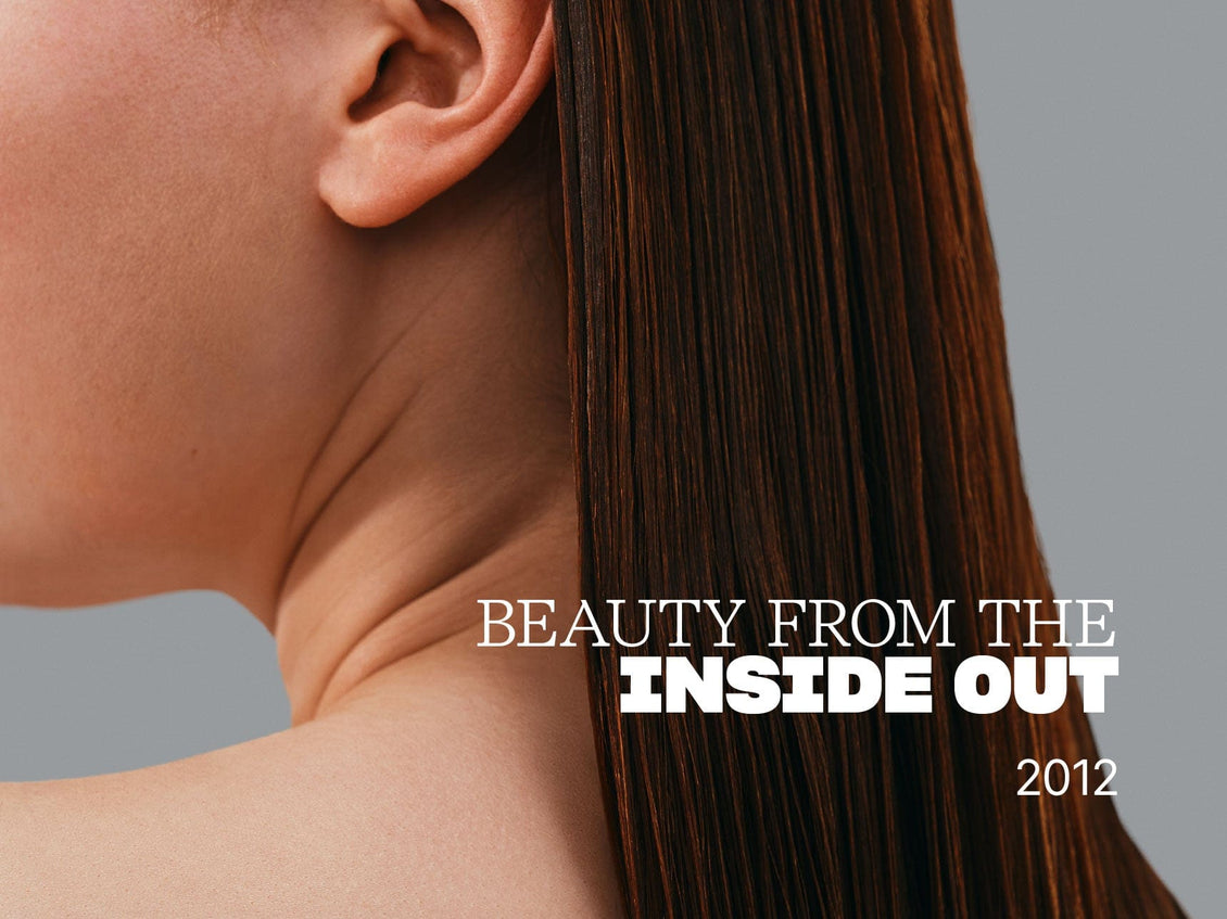 Close-up of a person's neck and shoulder with text 'Beauty from the Inside Out 2012' on a gray background