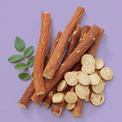 Licorice branch and slices on a purple background