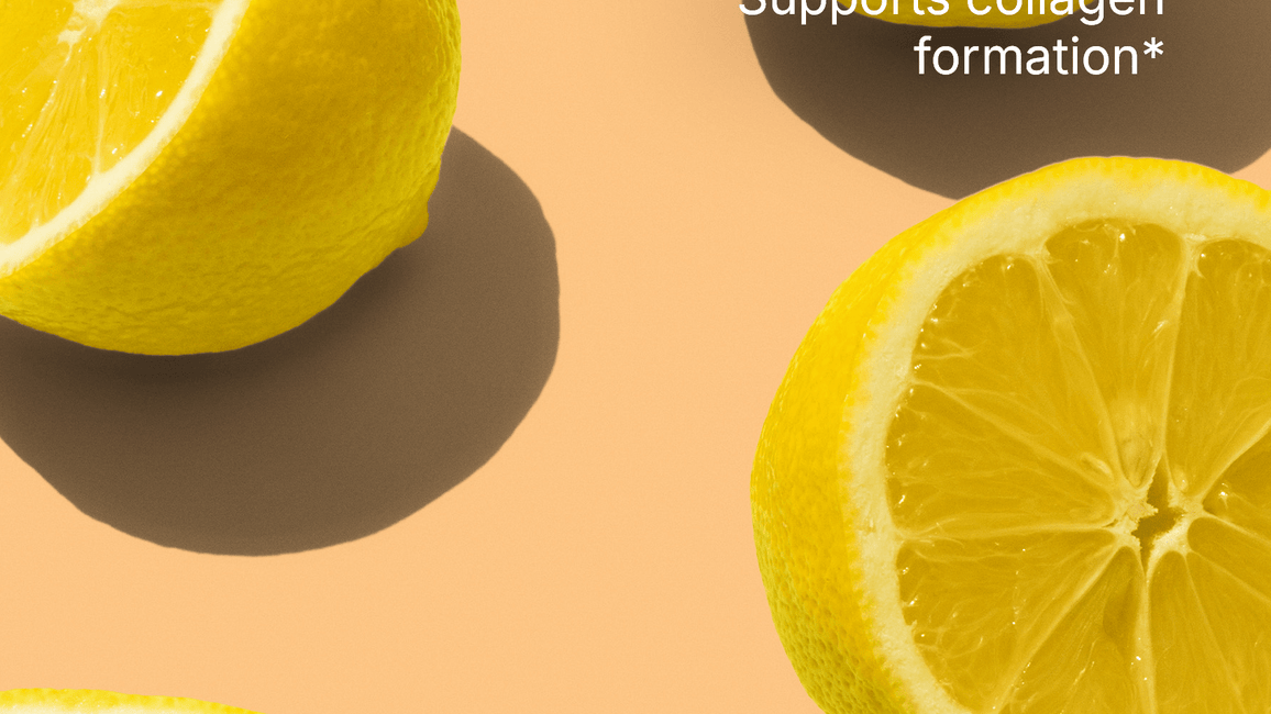 Sliced lemons on a peach background with text reading ‘Vitamin C supports collagen formation.’ Small text reads: ‘Vitamin C in this product is not sourced from lemons.